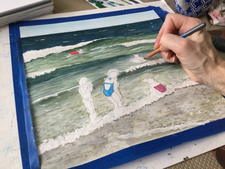 Painting figures on the beach