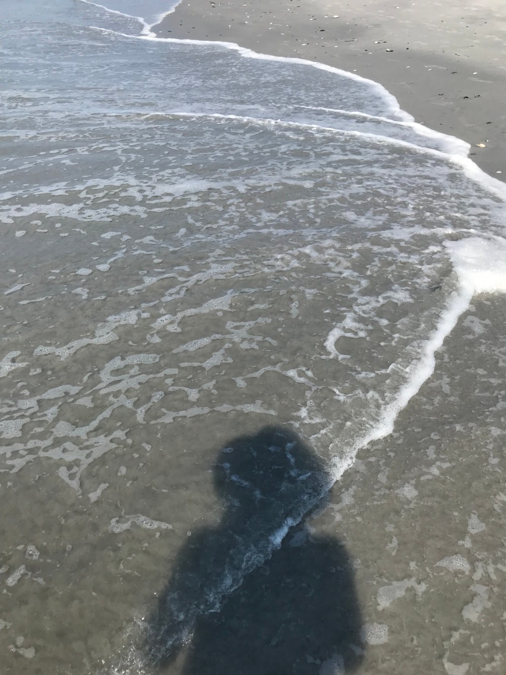 Beach day by Eileen McKenna shadow in the foam